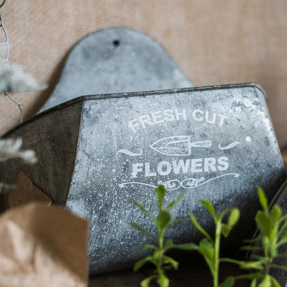 Iron Flower Wall Planter in galvanized metal with rustic finish on Tampa Home & Garden Store