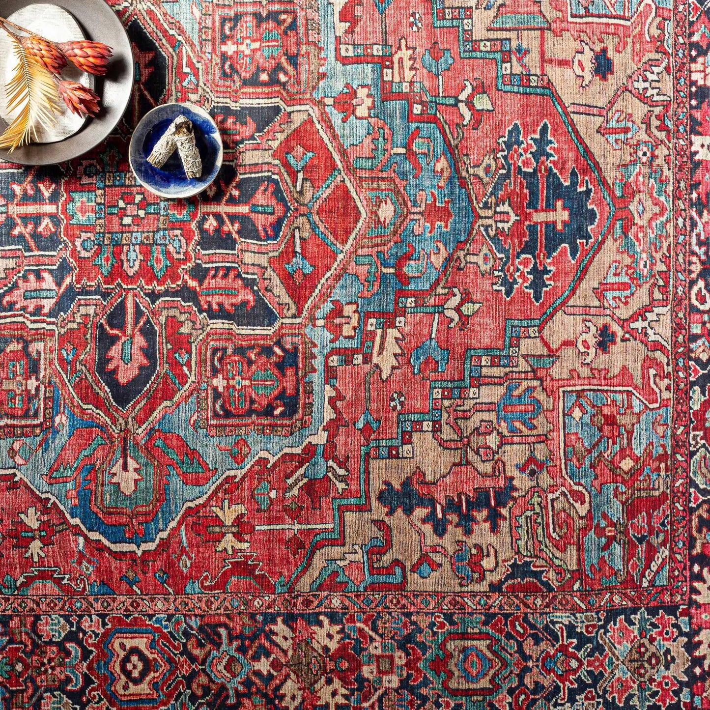 Neyland area rug by Boutique Rugs; vivid red teal and blue geometric Persian-inspired pattern on Tampa Home & Garden Store