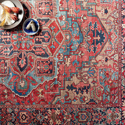 Neyland area rug by Boutique Rugs; vivid red teal and blue geometric Persian-inspired pattern on Tampa Home & Garden Store