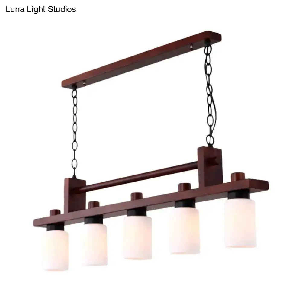 Decorbites linear wood island pendant with five opal glass shades in dark wood finish on Tampa Home & Garden Store