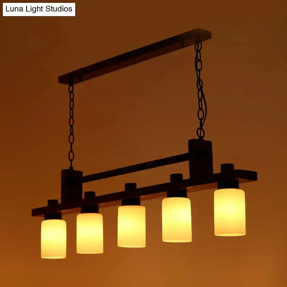 Linear wood island pendant by Decorbites with opal glass shades, five-light dining fixture on Tampa Home & Garden Store