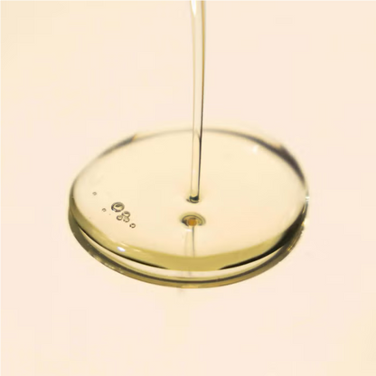 Elemis Japanese Camellia Body Oil Blend being poured into a clear glass dish, pale golden oil on Tampa Home & Garden Store