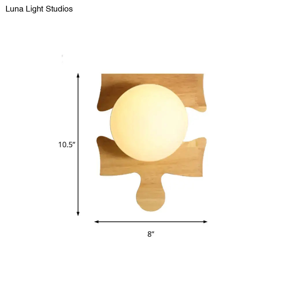 Wooden puzzle wall light with round globe on backplate by Decorbites, 10.5 in tall, 8 in wide on Tampa Home & Garden Store