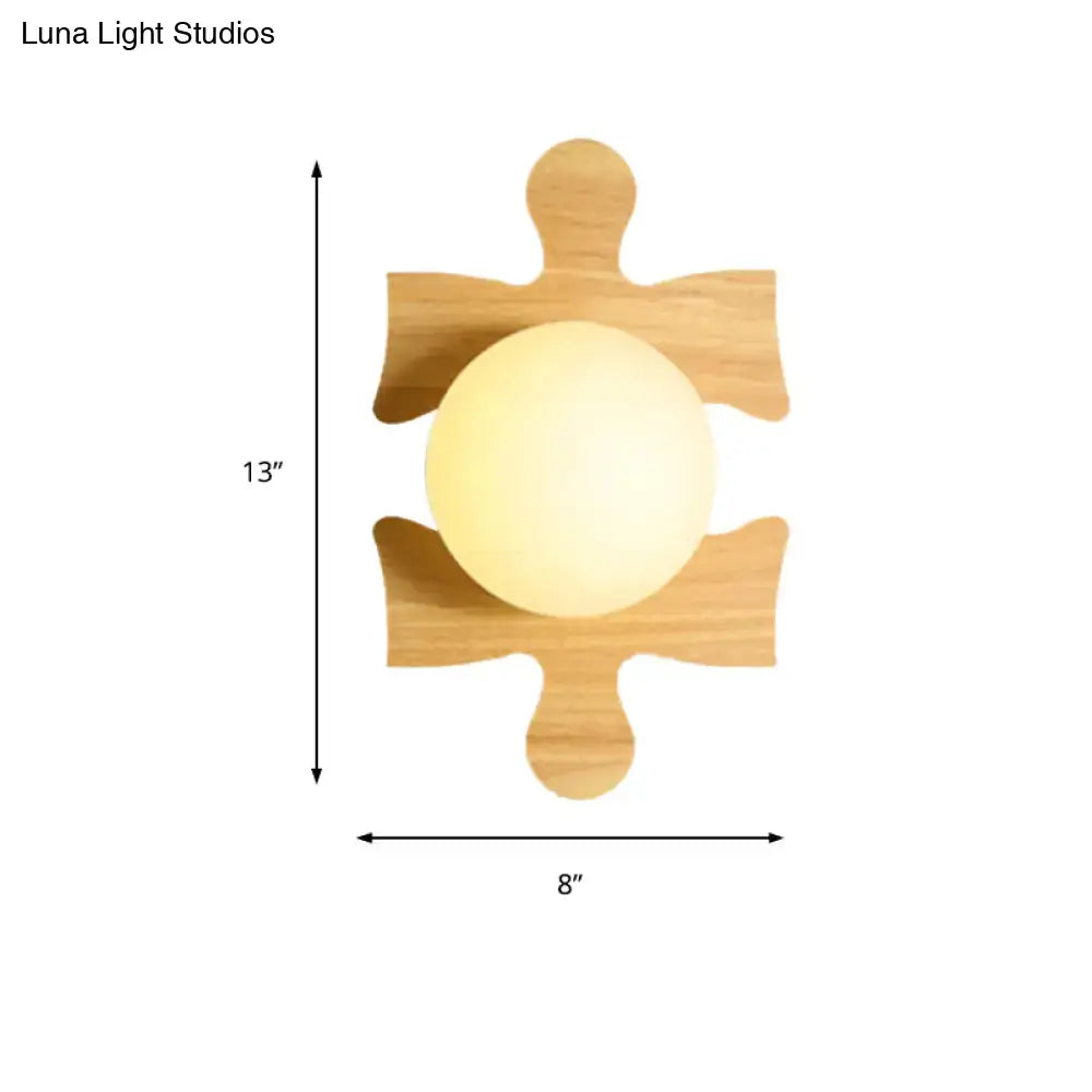 Wooden Puzzle Wall Light by Decorbites with natural wood puzzle-piece frame and warm white globe on Tampa Home & Garden Store