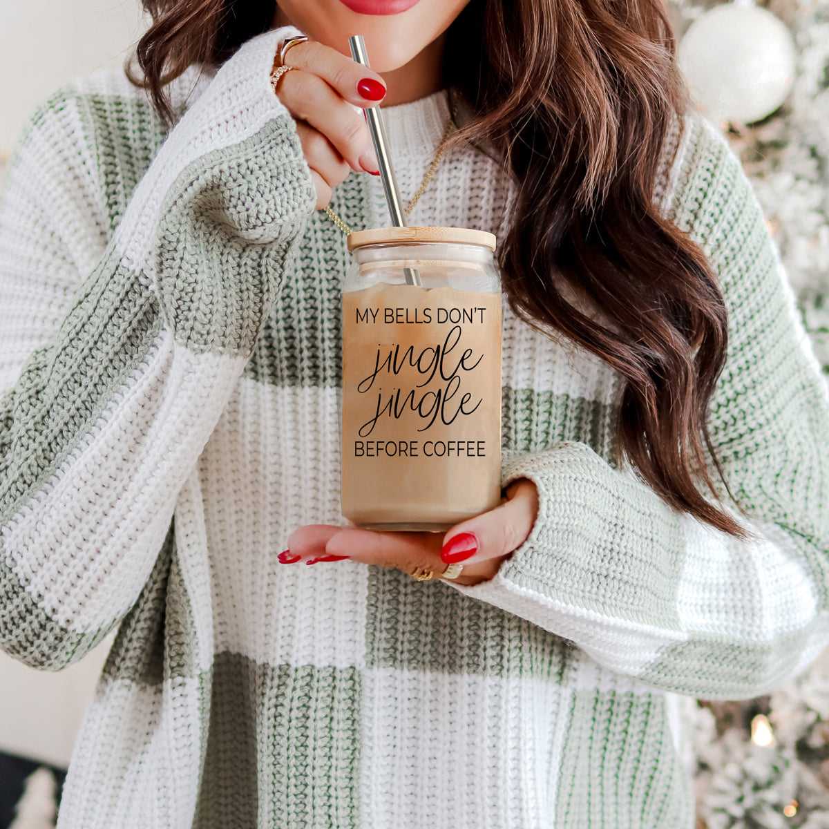 Jingle Jingle 17oz glass cup by Gia Roma with metal straw holding iced coffee on Tampa Home & Garden Store