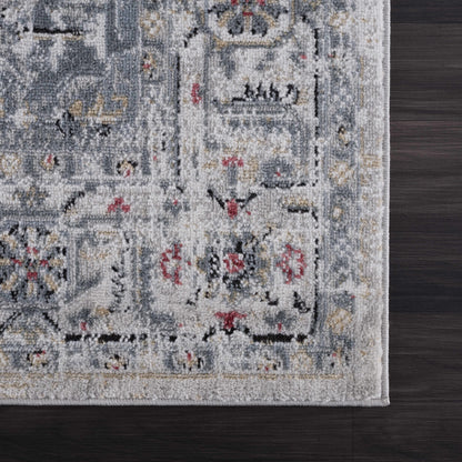 Billings Area Rug by Boutique Rugs in blue-gray with fringe on floor on Tampa Home & Garden Store