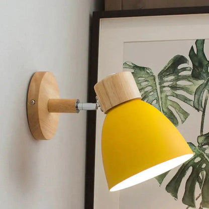 Yellow wood wall lamp sconce with round wooden mount and angled yellow shade by Decorbites on Tampa Home & Garden Store