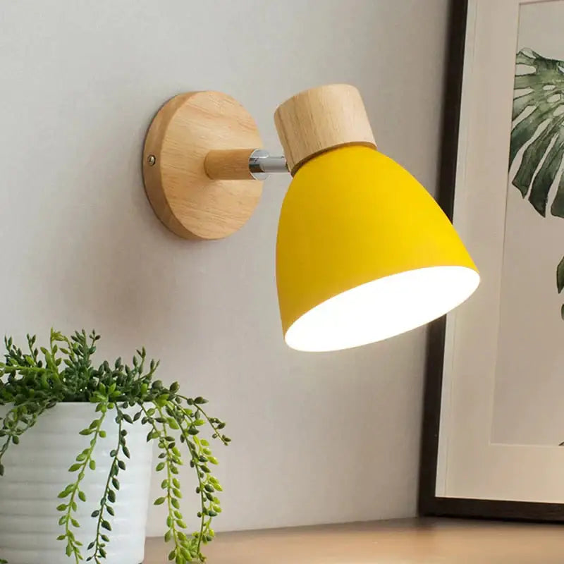 Yellow cone shade wall sconce with wooden backplate and chrome arm on Tampa Home & Garden Store