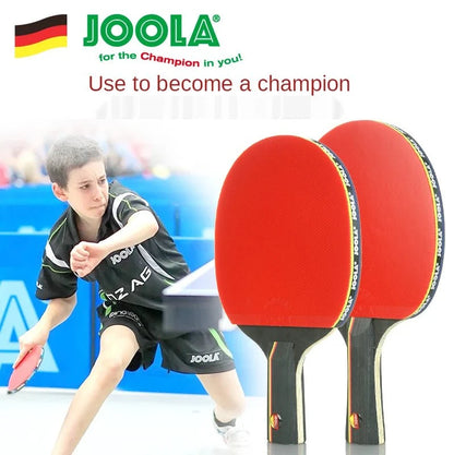 Carbon Table Tennis Rackets – 2 red paddles with black handles, JOOLA branding, player in background on Tampa Home & Garden Store