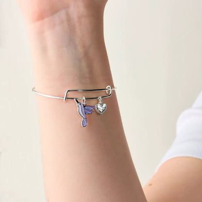 Joy hummingbird bracelet; silver-tone bangle with purple hummingbird charm and Joy heart charm on Tampa Home & Garden Store