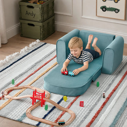 Tiny Land GentleSnug Kids Sofa Chair teal play sofa for kids with trains on striped rug on Tampa Home & Garden Store