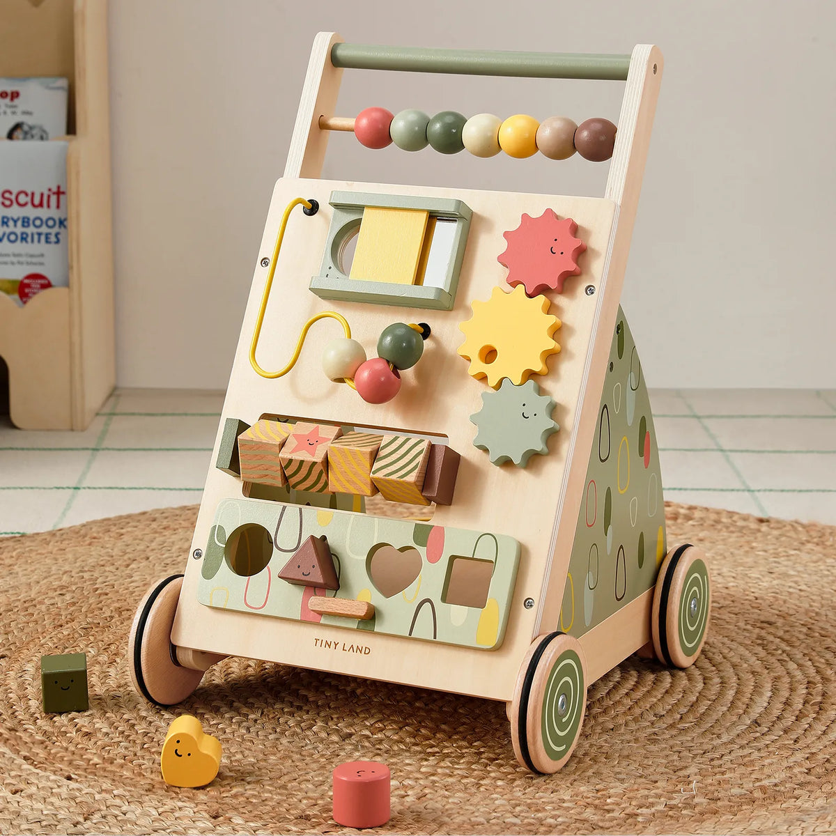Tiny Land sage green wooden baby walker with bead maze, gears and colorful blocks on Tampa Home & Garden Store