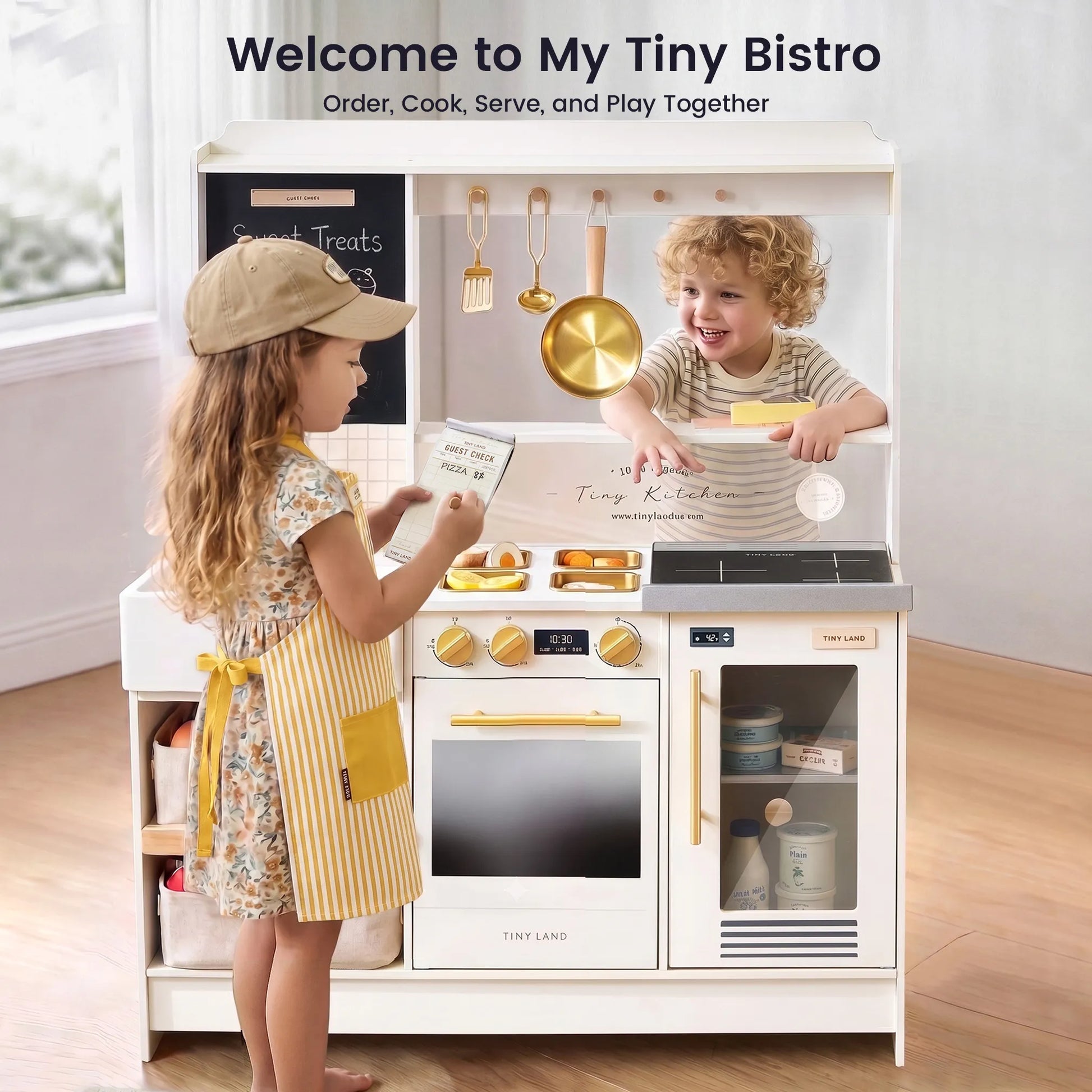 Tiny Land BistroSwitch Play Kitchen with white finish and gold hardware; two kids playing on Tampa Home & Garden Store