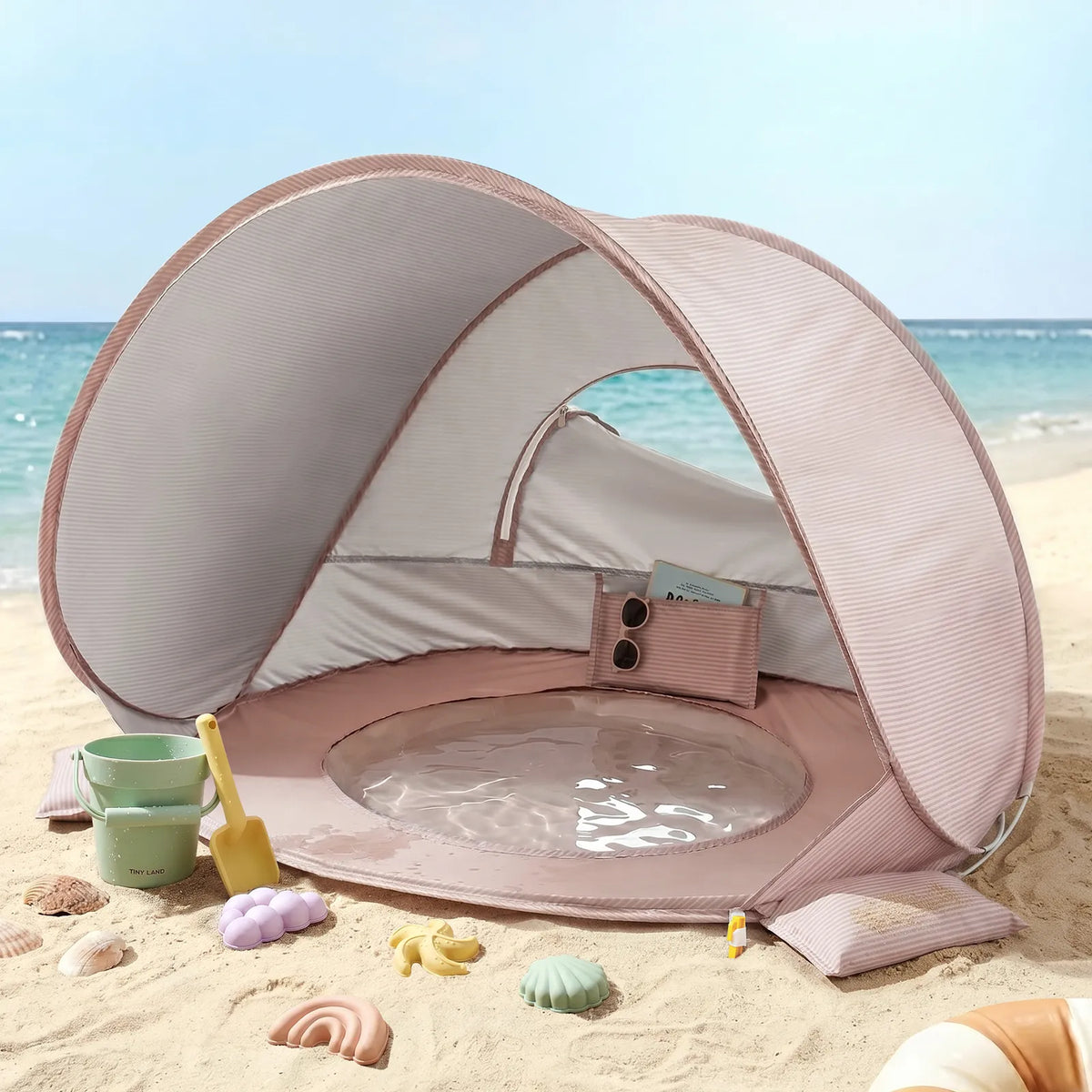 Tiny Land 3-in-1 Baby Beach Tent pink striped beach shelter on sandy beach with toys on Tampa Home & Garden Store