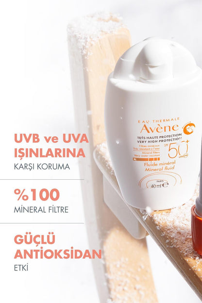 Avène mineral sunscreen SPF 50+ bottle, white with orange branding, on frosty wooden rail on Tampa Home & Garden Store