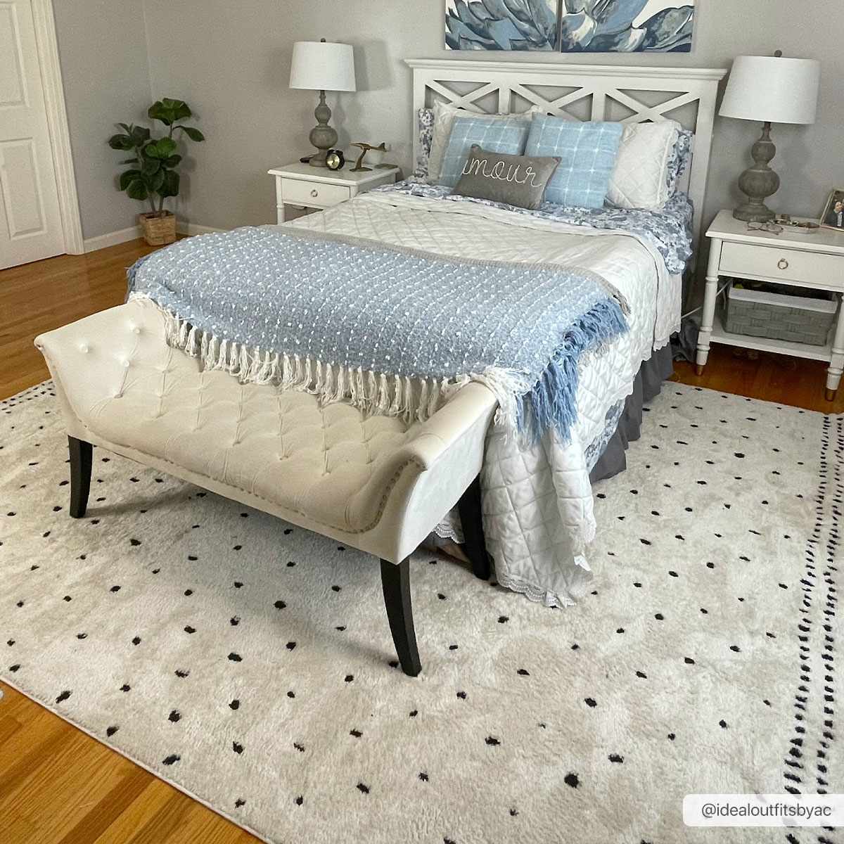 Julie Area Rug from Boutique Rugs; cream rug with tiny black dots in a white bedroom on Tampa Home & Garden Store