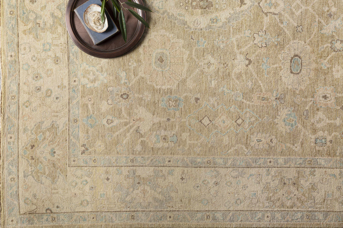 Karalee Handmade Wool Area Rug by Boutique Rugs, beige with soft blue accents on Tampa Home & Garden Store