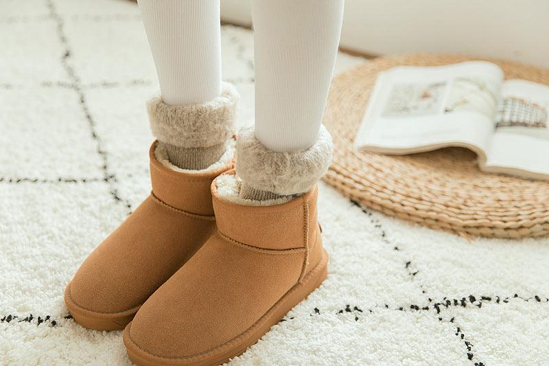 Stevvex crew socks with plush fleece cuff peeking from tan ankle boots for cozy winter look on Tampa Home & Garden Store
