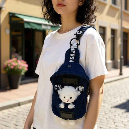 Denim blue Shaketea crossbody sling bag with white sheep charm, front pocket, adjustable strap on Tampa Home & Garden Store
