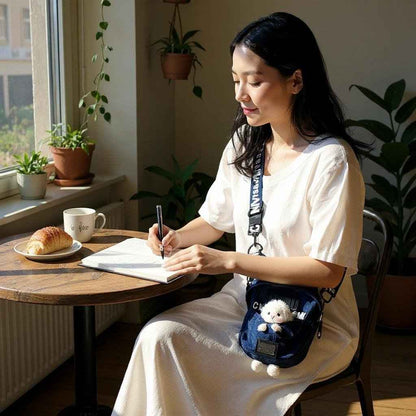 Kawaii denim crossbody sling bag Shaketea with sheep charm on adjustable strap worn by lady on Tampa Home & Garden Store