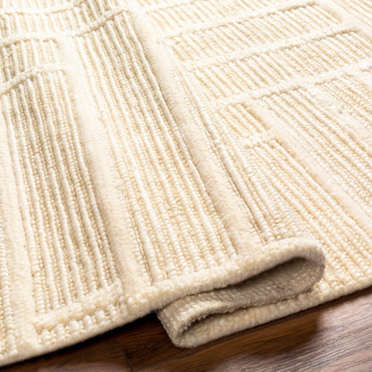 Kelburn Area Rug by Boutique Rugs, cream loop-pile texture folded edge on wood floor on Tampa Home & Garden Store