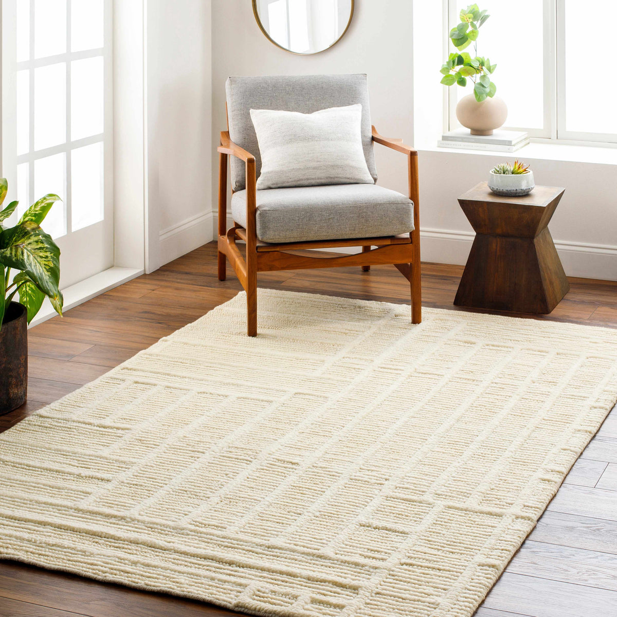 Kelburn Area Rug cream textured rug by Boutique Rugs in a bright living room on Tampa Home & Garden Store