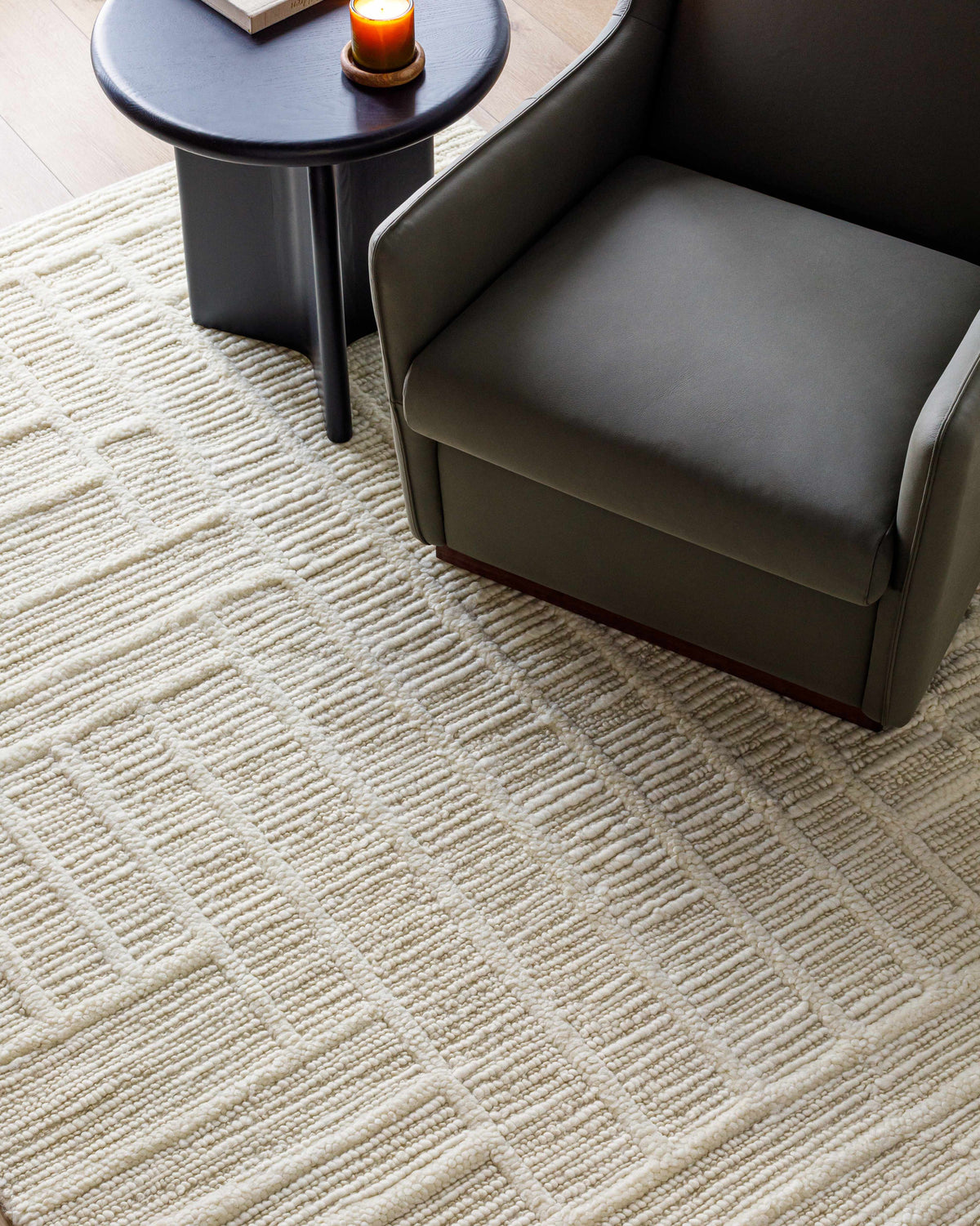 Kelburn Area Rug cream textured weave in a living room scene on Tampa Home & Garden Store