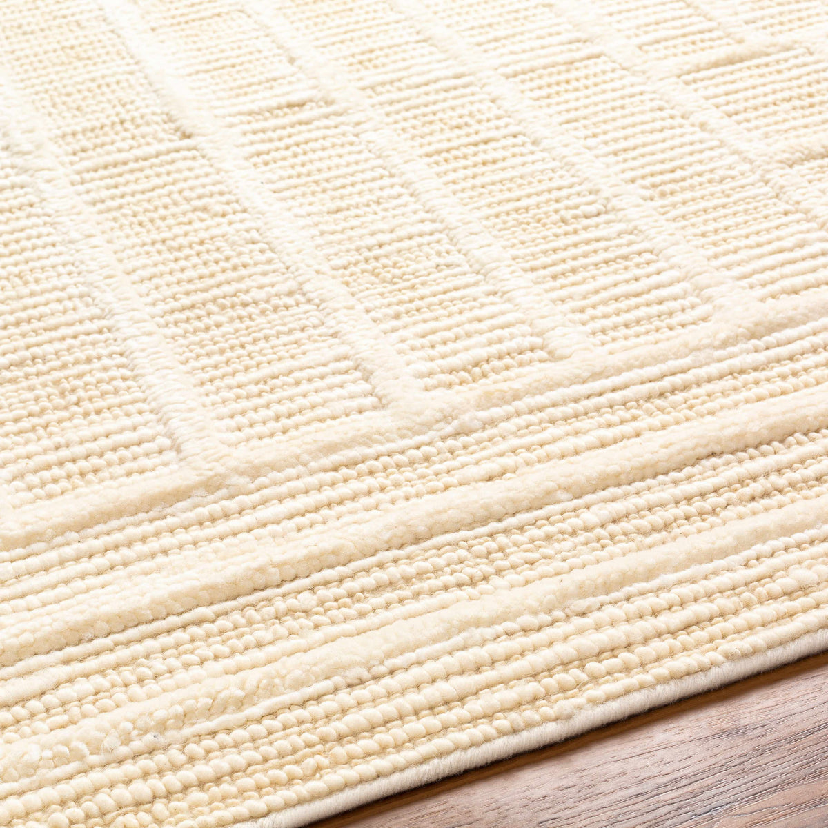 Kelburn Area Rug in cream boucle texture on Tampa Home & Garden Store