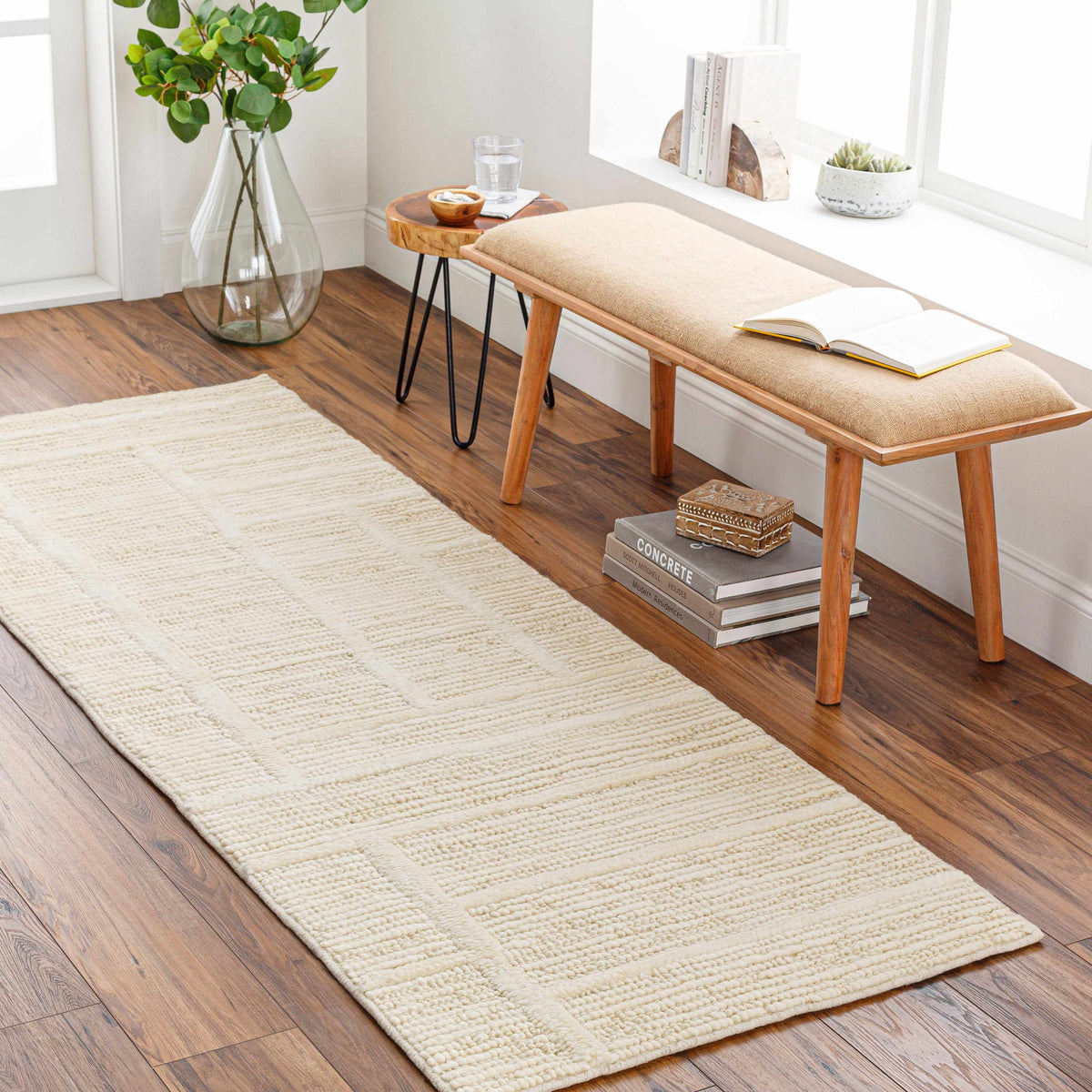 Kelburn Area Rug - Clearance cream woven rug in a sunny living space on Tampa Home & Garden Store