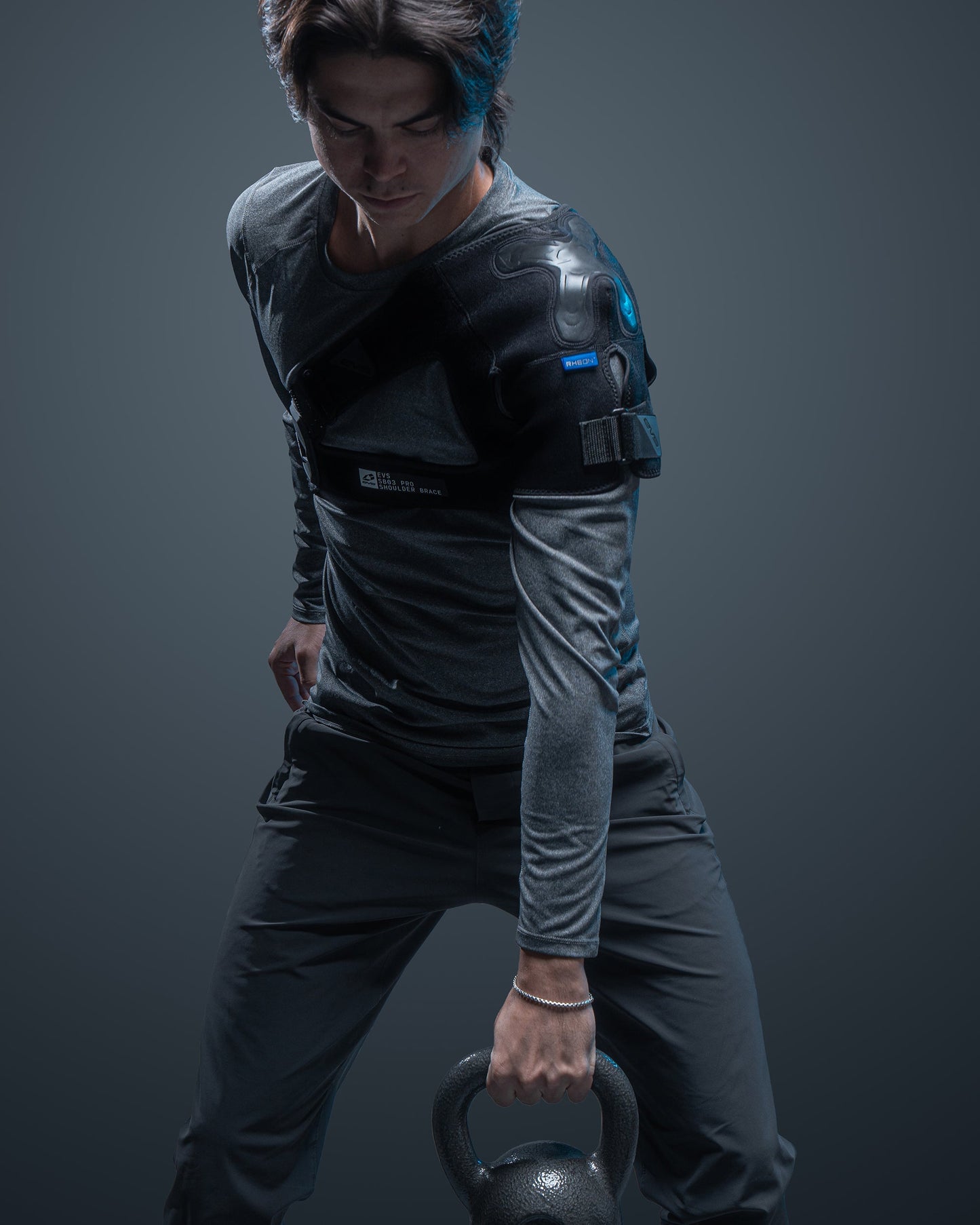 SB03 Pro Shoulder Support EVS Sports black shoulder brace with blue accents worn on shoulder on Tampa Home & Garden Store