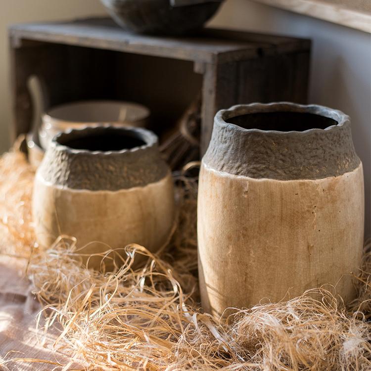 Khaki Coarse Pottery Jars by RusticReach; two beige jars with dark gray rims on straw on Tampa Home & Garden Store