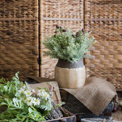 Khaki coarse pottery jar with dark gray lip by RusticReach holding green foliage on burlap on Tampa Home & Garden Store