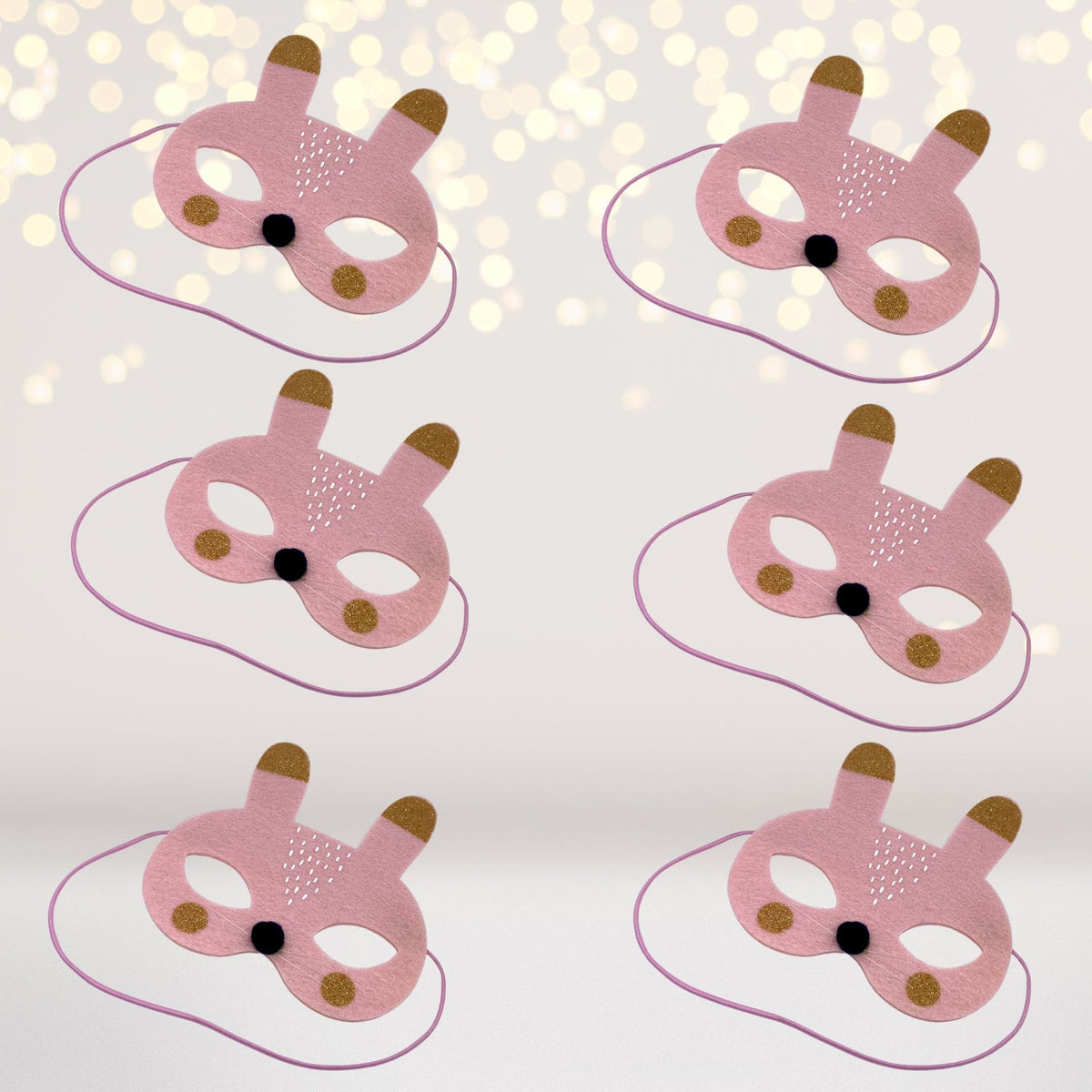 Set of pink bunny rabbit felt Easter masks for kids with gold glitter dots and stitch accents on Tampa Home & Garden Store