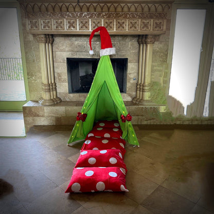 Green teepee play tent with red polka-dot floor cushions and red bows for holiday pretend play on Tampa Home & Garden Store