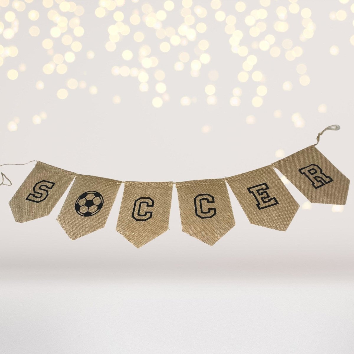 Play Set banner with burlap pennants spelling SOCCER and a soccer ball icon on Tampa Home & Garden Store