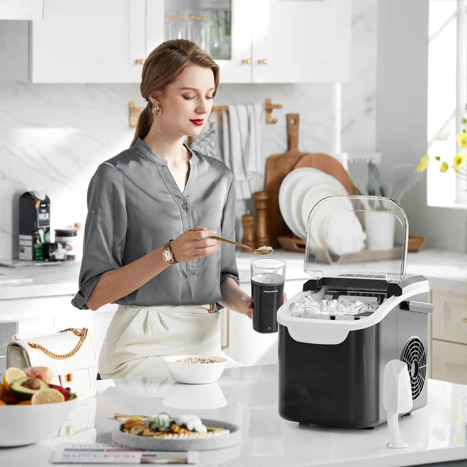 Kismile countertop ice maker with clear lid and black body on a bright kitchen counter on Tampa Home & Garden Store