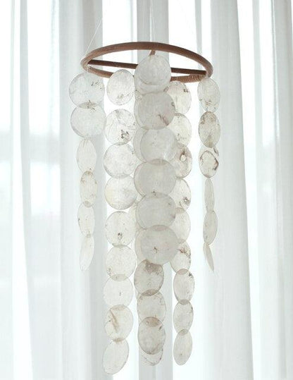 Korean style shell wind chime with white discs hanging from a wooden ring for home decor on Tampa Home & Garden Store