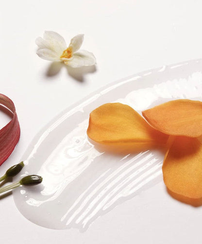 LABO-H Shampoo swatch on white plate with orchid and orange petals Blanche&Woody on Tampa Home & Garden Store
