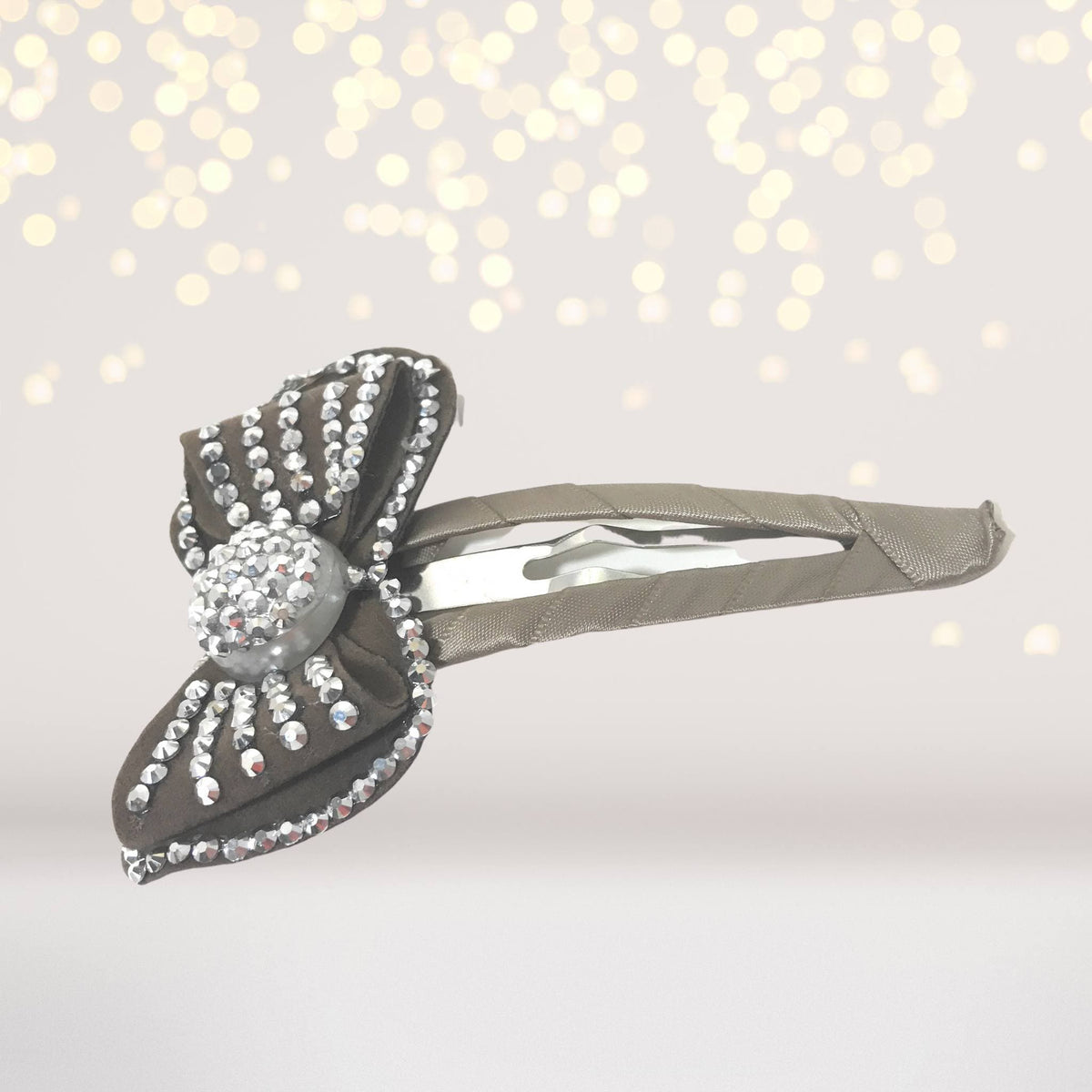 Large bling bow snappy clip with rhinestone-draped dark fabric bow on Tampa Home & Garden Store