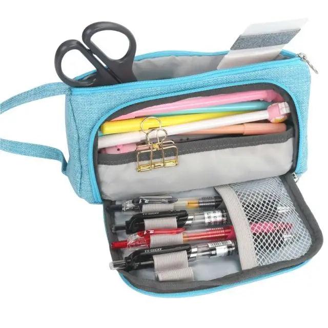 Blue large-capacity pencil case open to reveal scissors, pens, pencils and a mesh pocket on Tampa Home & Garden Store