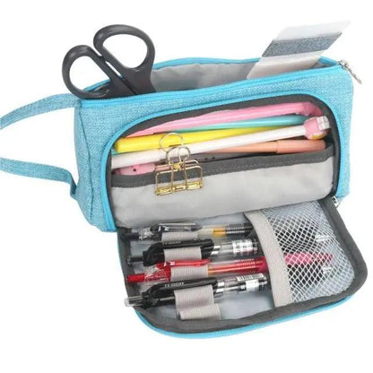 Blue large-capacity pencil case open to reveal scissors, pens, pencils and a mesh pocket on Tampa Home & Garden Store