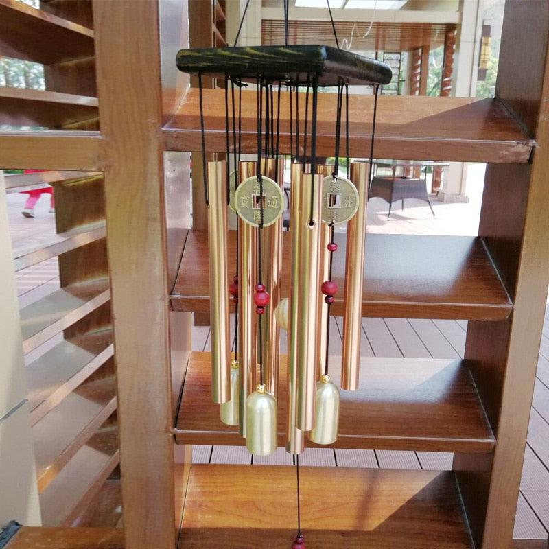 Large copper wind chime with multiple tubes and coin pendants, red beads on Tampa Home & Garden Store