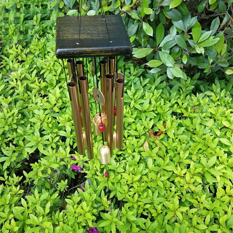 Large copper wind chime with wooden top and copper tubes and coin pendant for outdoor decor on Tampa Home & Garden Store