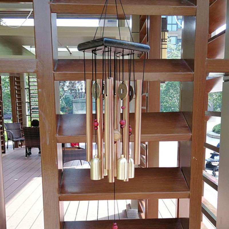 Large copper wind chime with multiple tubes and coin pendants, bell accents on Tampa Home & Garden Store