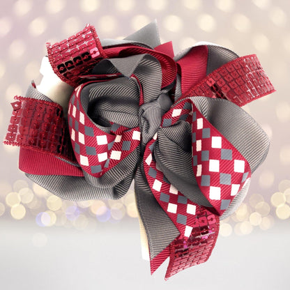 Large sequin boutique hair bow with red sequined ribbon and layered gray satin loops on Tampa Home & Garden Store