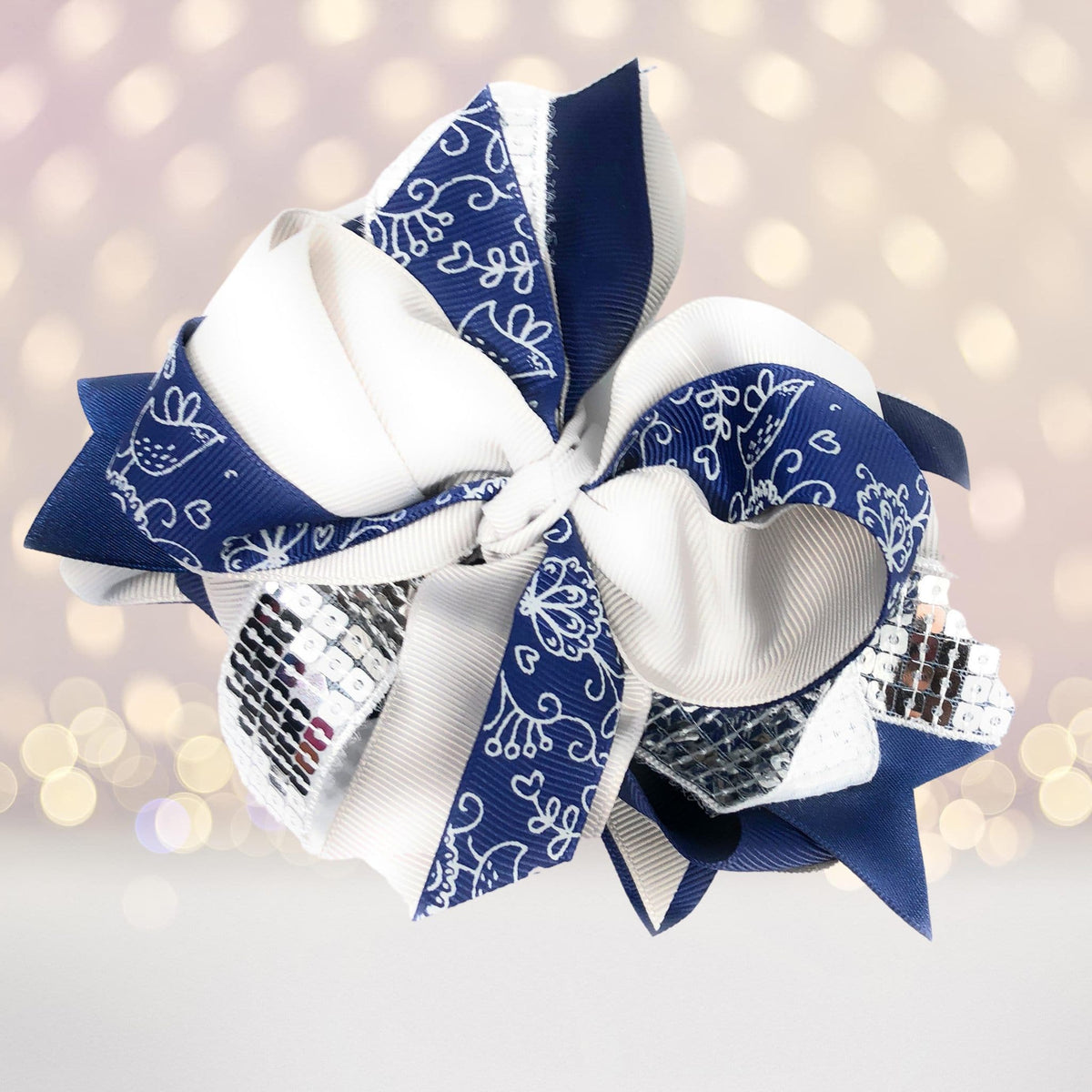 Large Sequin Boutique Hair Bow featuring navy blue and white swirl-pattern ribbons on Tampa Home & Garden Store