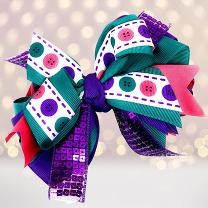 Large sequin boutique hair bow with teal and purple ribbons and a white dotted-edge ribbon on Tampa Home & Garden Store