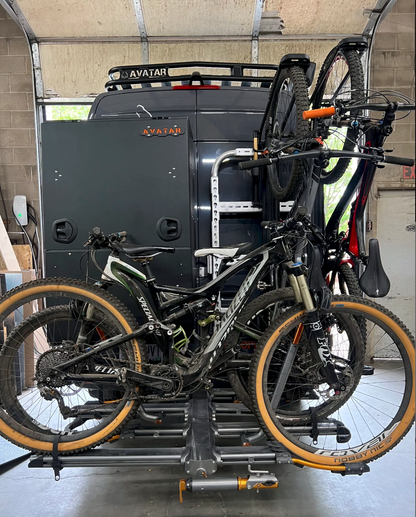 Avatar Giga Largest Storage Box gray metal cargo box mounted on vehicle with two bikes on Tampa Home & Garden Store