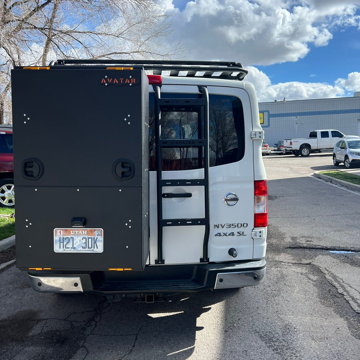 Avatar NV3500 Rear Ladder on van; black metal ladder rack and storage box on Tampa Home & Garden Store