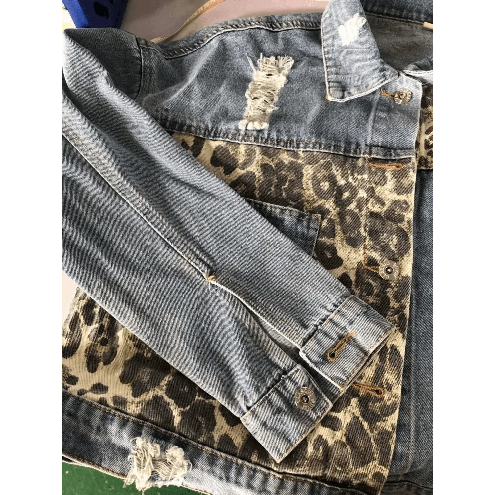 Leopard print denim trucker jacket with distressed patches and long sleeves on Tampa Home & Garden Store